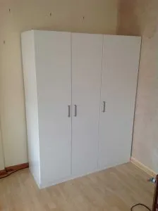 Flat pack wardrobe Mile End project featuring the expert assembly of a white 3-door unit.