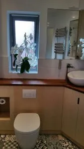 Bathroom renovation in Surrey Quays showing modern tiling and fixtures