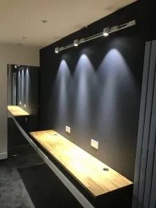Complete boys stylish bedroom renovation in London, transforming the room with modern storage, bold accent colours, feature walls, and creative lighting.